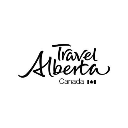 Travel Alberta Canada logo with stylized script text and two small Canadian flags, perfect for vacation rental management in Canmore.