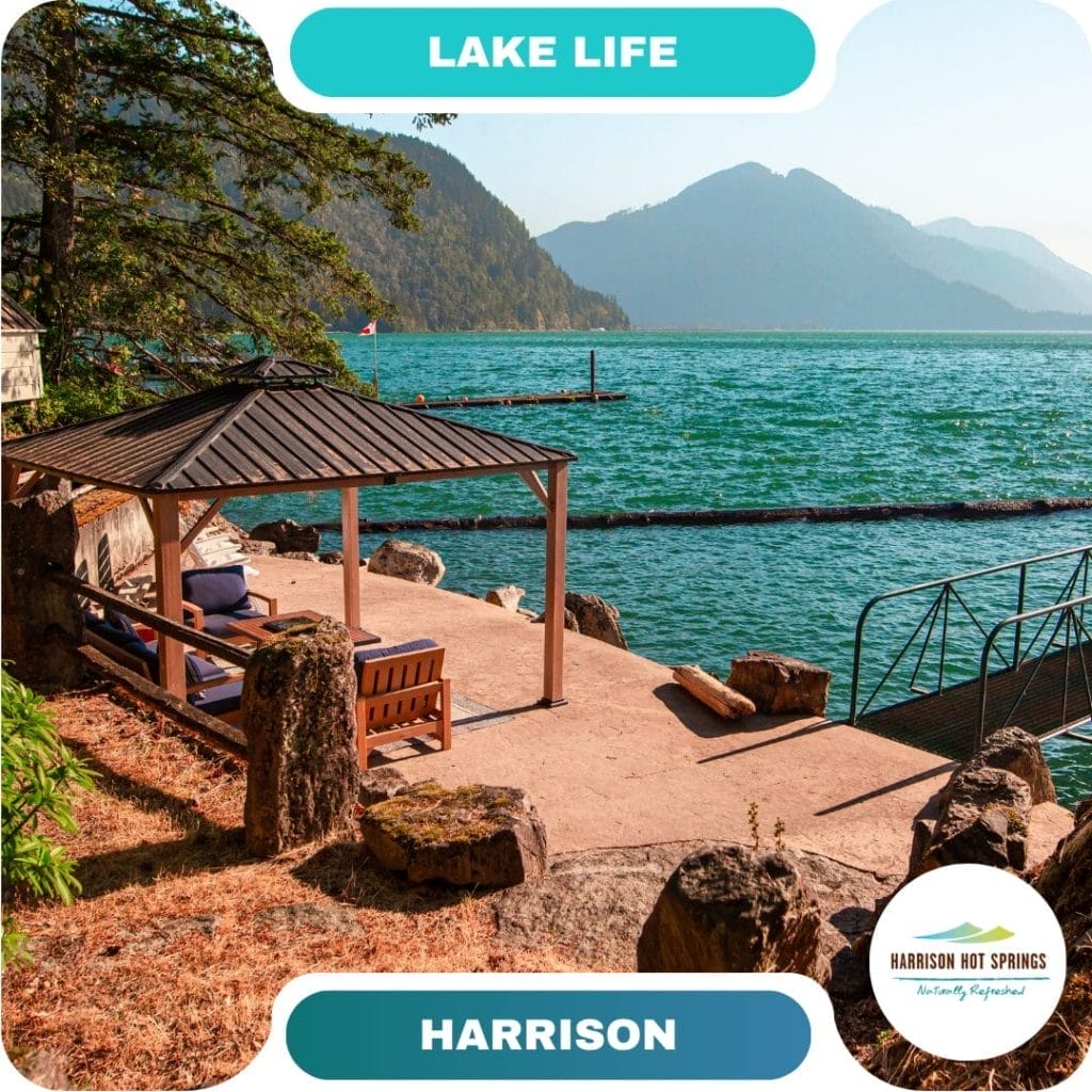 A lakeside patio with a gazebo, bench, and chairs invites guests to relax as they overlook a dock and calm turquoise water, with forested mountains in the background at one of Harrison Hot Springs' scenic destinations.