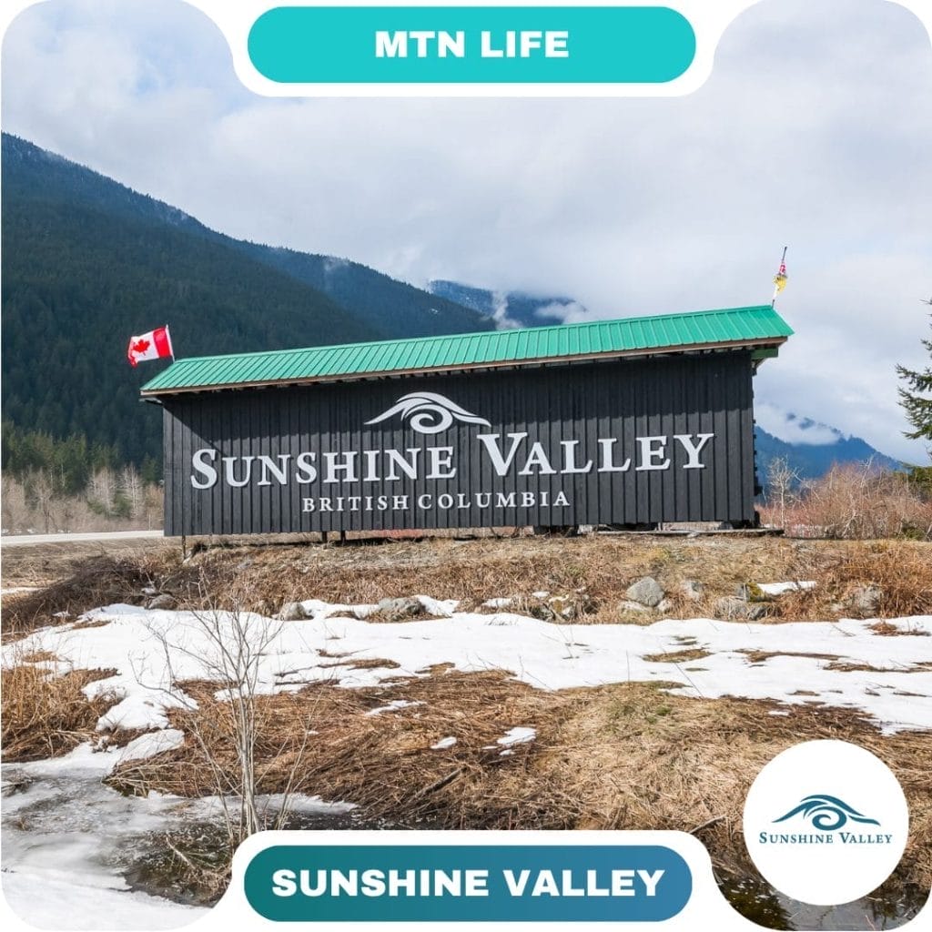 A wooden building with a green roof displays "Sunshine Valley British Columbia" signage; snow and mountains are visible in the background, making it a welcoming stop for guests exploring picturesque destinations.