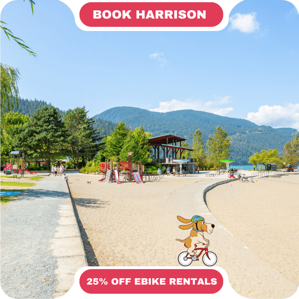Sandy lakeside park with playground, pavilion, and distant mountains under a clear sky; promo text advertises 25% off e-bike rentals and booking in Harrison—plus tips on vacation rentals in Whistler.